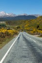 Cars travelling along the Milford Sound Road, just outside of Te Anau, New Zealand Royalty Free Stock Photo