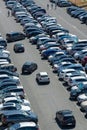 Cars trying to park in an outdoor full parking lot in summer, France