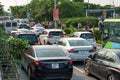 Cars on urban street in traffic jam at rush hour in big city Royalty Free Stock Photo