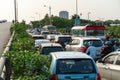 Cars on urban street in traffic jam at rush hour in big city Royalty Free Stock Photo