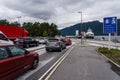 Cars waiting for the arriving road ferry to take them to the other side of the fjord