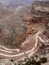 SUV cars on windy dirt road in Canyonlands National Park, Shafer Trail, Utah, USA.