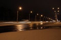 Cars on the winter road with snow. Dangerous car traffic in bad weather with bokeh at night to use background Royalty Free Stock Photo