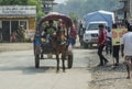 Cart driver with horse riding on the street