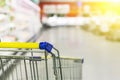 Cart at the grocery store. Abstract blurred photo of store with trolley in department store bokeh background. Royalty Free Stock Photo