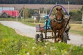 A cart with a horse in a Russian village. Royalty Free Stock Photo