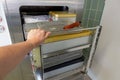 Cart loaded with surgical instruments is pushed into the sterilizer