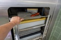 Cart loaded with surgical instruments is pushed into the sterilizer