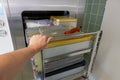 Cart loaded with surgical instruments is pushed into the sterilizer