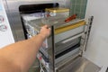 Cart loaded with surgical instruments is pushed into the sterilizer