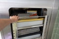 Cart loaded with surgical instruments is pushed into the sterilizer