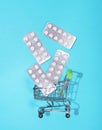 Cart out of the store with tablets. Blue background. Royalty Free Stock Photo