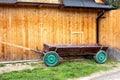 Cart parked in front of wooden barn in Slovakia