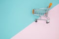 Cart on pink and blue background