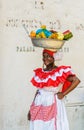 Palenquera woman sells fruits at Plaza Santo Domingo