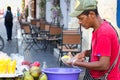 A fruit vendor cutting mango in Cartagena.