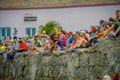 CARTAGENA, COLOMBIA - NOVEMBER 07, 2019: Unidentified spectators sitting in a wall at the independence day parade on the