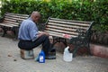 Street shoe polisher sit lonely waiting for clients at the Bolivar park in the