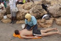A woman gives a massage in Bocagrande beach, Colombia
