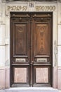 Old wooden and marble door with beautiful iron door handles