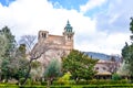 The Carthusian Monastery of Valldemossa, in Valldemossa, Mallorca, Spain surrounded by a green park in the courtyard. Famous