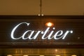 Cartier, illuminated jewelry brand name on Champs Elysees avenue in Paris