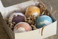 Carton box with bath bombs on table