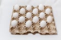 carton box with distanced white eggs on white background. concept of quarantine rules Royalty Free Stock Photo