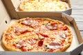 Carton boxes with delicious pizzas Royalty Free Stock Photo