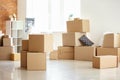 Carton boxes and interior items in room. Moving house concept Royalty Free Stock Photo