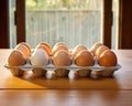 carton of eggs stored in row wise with proper lighting and placed on the table.