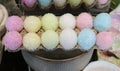 A carton of pastel glittery fuzzy decorative Easter eggs