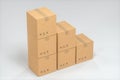 The cartons are stacked against a white background, 3d rendering