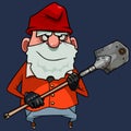 Cartoon bearded gnome in a red cap stands with a shovel in his hands