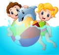 Cartoon boy and girl playing beach ball with dolphin on water Royalty Free Stock Photo