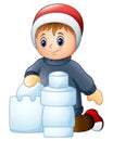 Cartoon boy making snow building Royalty Free Stock Photo