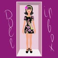 Cartoon brunette doll flowered black short summer dress. The toy is in an open box