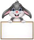 Cartoon bunny holding blank sign Royalty Free Stock Photo