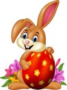 Cartoon bunny holding easter egg