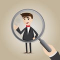 Cartoon businessman with magnifier