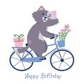 Happy birthay card with a cat on a bike carrying a present and flowers.