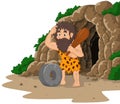 Cartoon caveman inventing stone wheel with cave background
