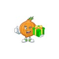 Cartoon character of happy shallot with gift box