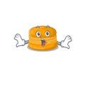 A cartoon character of orange macaron making a surprised gesture