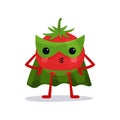 Cartoon character of red tomato in green mask, cape and pants standing with arms akimbo