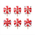 Cartoon character of red white peppermint lolipop with smile expression