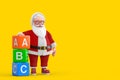 Cartoon Cheerful Santa Claus Granpa with Alphabet ABC Education Cubes. 3d Rendering Royalty Free Stock Photo