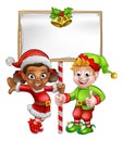 Cartoon Christmas Elves Holding Sign Royalty Free Stock Photo