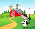 Cartoon cow holding blank sign with farm background Royalty Free Stock Photo