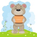 Cartoon a cute happy bear carries a barrel of honey